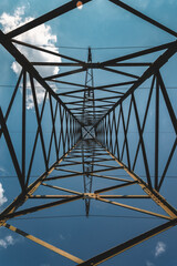 Symmetrical low angle view of an electricity pylon.