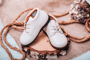 Girl shoes over rustic wooden deck. Vintage filtered image.