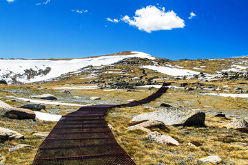 The walking track to Mount Kosciuszko in the Snowy Mountains, New South Wales, Australia....