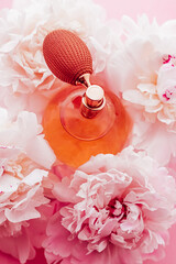 Vintage fragrance bottle as luxe perfume product on background of peony flowers, parfum ad and...