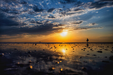 Elton Salt Lake at sunset with beautiful clouds and warm sunny color.