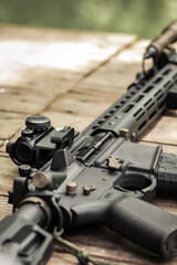 AR15 automatic assault rifle weapon with aim sight and flashlight