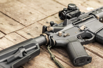 AR15 automatic assault rifle weapon with aim sight and flashlight