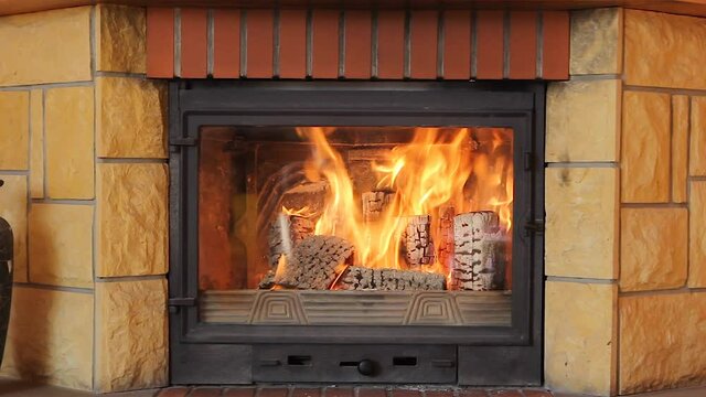 Burning fireplace at home. burning firewood