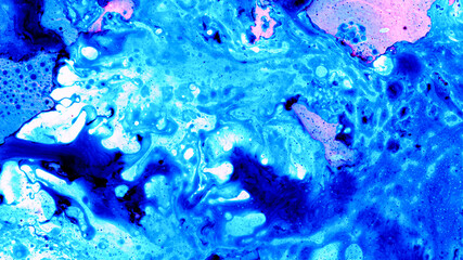 Abstract background of colored liquid, top shot, close-up.