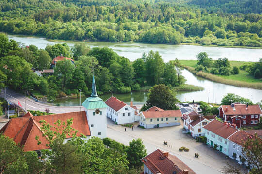 View over G&ouml;ta &auml;lv river near Kung&auml;lv, Sweden with a old church and resisdential buildings