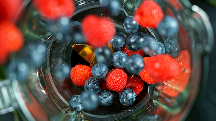 Berries fresh smoothie blended in blender, top view. Healthy eating concept.