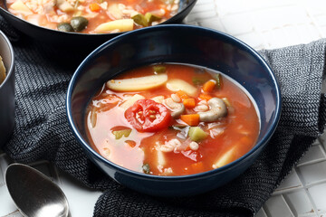 Vegan tomato soup with barley, oyster mushrooms, potatoes, carrots, onions and pickles