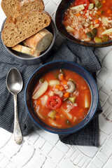 Vegan tomato soup with barley, oyster mushrooms, potatoes, carrots, onions and pickles