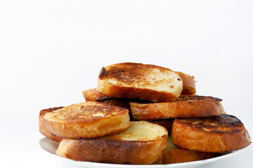 Fresh toast bread on a plate on a white background
