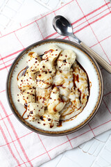 Oatmeal porridge with bananas and date syrup