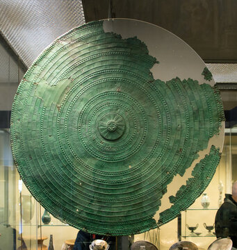 Vatican, Italy - January, 04, 2020. Ancient Etruscan bronse shield on display of the Museums of Vatican. The Museum holds one of the biggest collection of ancient art objects.