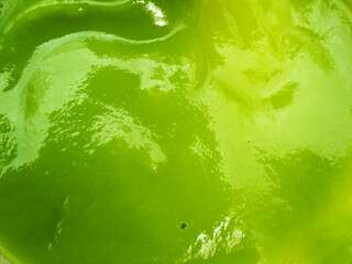 closeup green pandan custard dipping sauce surface texture background