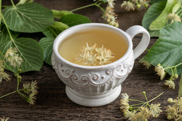 A cup of herbal tea with linden flowers