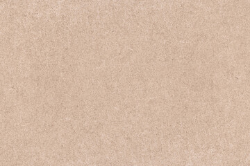Fototapeta na wymiar Cardboard background, uniform sheet of rough paper, beige texture of recycled eco-friendly cardboard