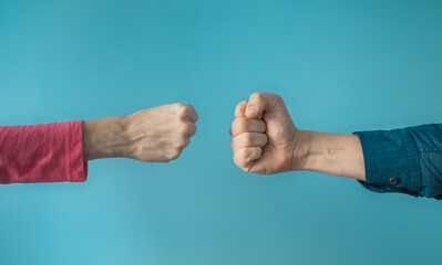 Two people making fist bump. People teamwork, and togetherness concept. 