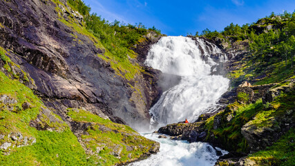 Naklejka na ściany i meble It's Beautiful legendary Huldra (a seductive forest creature in Scandinavian folklore) dance on the Kjosfossen waterfall in Norway