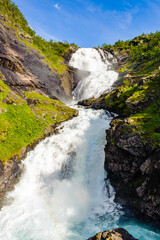 Fototapeta premium It's Beautiful legendary Huldra (a seductive forest creature in Scandinavian folklore) dance on the Kjosfossen waterfall in Norway