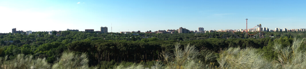 Fototapeta na wymiar Madrid amusement park (Parque de Atracciones de Madrid) panoramic view from a view point