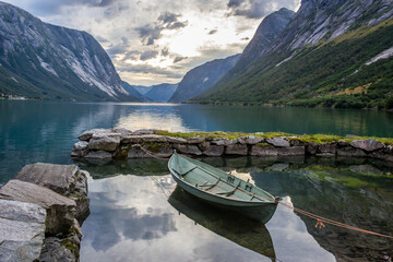 sunset and heavy clouds over the fjord in Norway