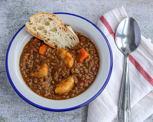 Lentil soup with vegetables and potatoes. Typical Spanish lentil soup. 