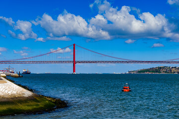 It's Bridge 25 of April in Lisbon, Portugal. It was inaugurated on August 6, 1966