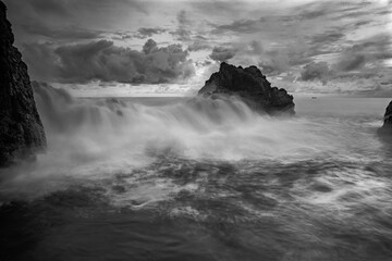 Sea waterfall silky motion effect view in rock beach