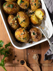 Baked potato with herbals and nuts 