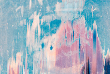 Pastel color background. Distressed texture. Pink blue white stains on scratched surface.