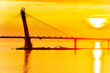 Bridge on the Sunset over the sea in Russia