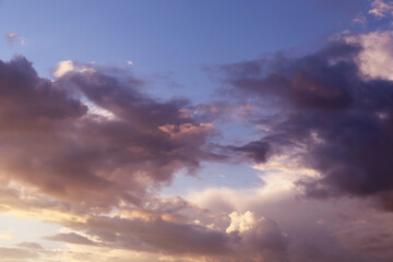 Naklejka na ściany i meble Blue sky with colorful clouds at sunset