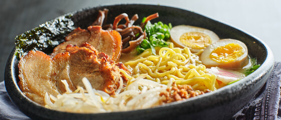 japanese tonkotsu ramen bowl on dinner table at restaurant