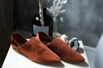 comfortable casual suede shoes for business meetings lie on a beautiful background, brown color of...