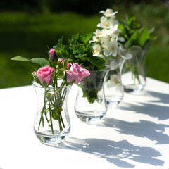 Flowers of rose, jasmine and mint leaves are in a Turkish glass mugs. Ingredients for Herbal Tea.