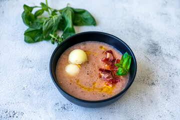Melon soup with iberian ham. Melon gazpacho.