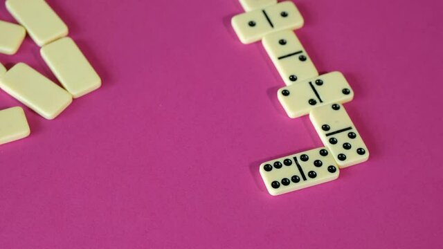 Boy playing domino while spending time at home. Children are play board games.