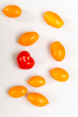yellow fresh organic tomatoes pattern on a white background, empty space for text
