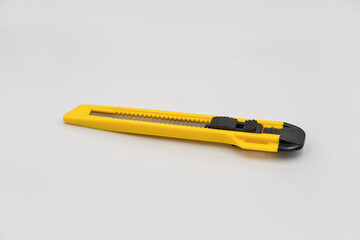 Office plastic knife for cut paper and other, closeup