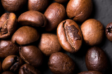 Coffee beans texture. Coffee in beans on dark background. Food background of coffee beans. Abstract background texture. Texture coffee.