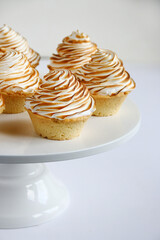 lemon meringue tart closeup on white background. lemon curd tart. tasty lemon mini meringue pie
