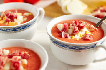Tomato soup, salmorejo, with raw ingredients on a table