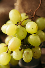 Bunch of green grapes on a dark background. Organic food.