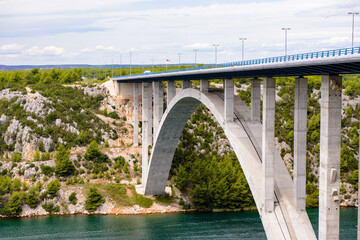 Fototapeta na wymiar It's Bridge over the River Krka and the nature of Croatia