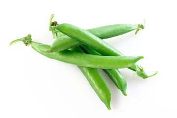 Pods of green peas with pea leaves and flowersd on a white background. Organic food.
