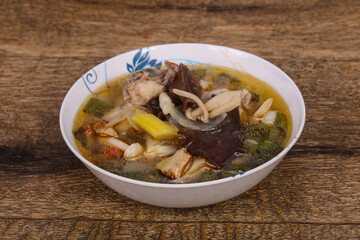 Thai style soup with meat and mushrooms