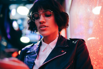Millennial Generation Y in classic eyewear for provide eyes protection listening music podcast...