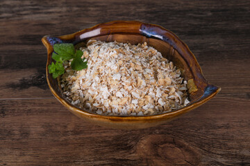 Raw oats in the bowl