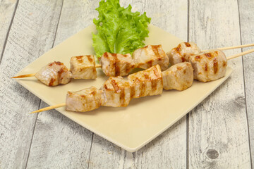Grilled pork skewer served salad