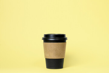 coffee cup with craft paper around snd space for logo