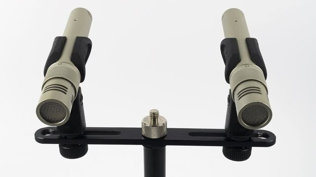 ZURICH, SWITZERLAND - MARCH 18, 2020: Animated stop motion of a pair of the small diaphragm condenser  microphones for studio recording.